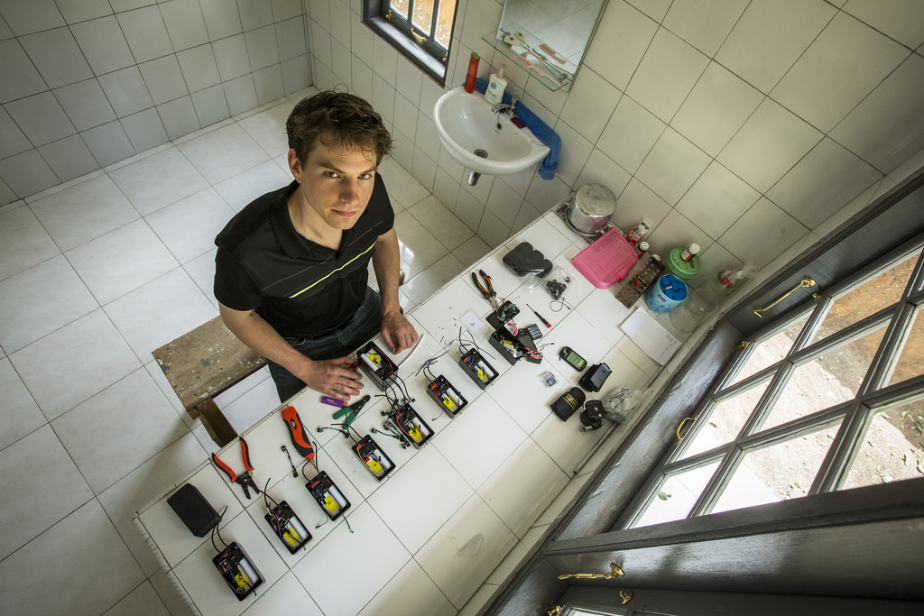 Is that guy building phones in a bathroom?
